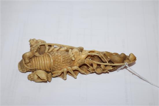 A Japanese ivory okimono of rats crawling over a lobster, early 20th century, unsigned 14.5cm